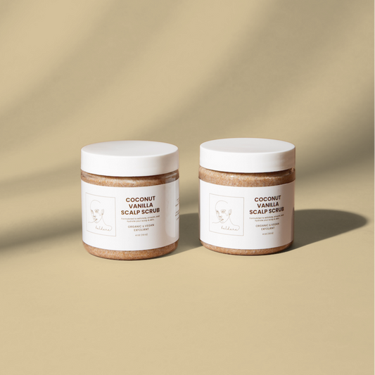 Two jars of coconut vanilla scalp scrub on a beige background